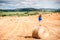 Woman on the hayfield