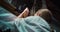 Woman head bowed in prayer to Holy Virgin Mary in church. Folded hands in prayer.