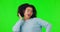 Woman, headphones and dancing to music on green screen with happiness, energy and connection. African female person on a