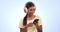 Woman, headphones and listening to music on mobile, audio streaming and podcast on a blue background. Young indian