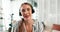 Woman, headphones and wave on video call in home with smile, face and greeting for online course. Girl, person and ESL