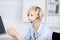 Woman with headset listening