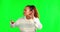 Woman, hearing problem and speak loud hand sign with green screen and ask for secret news. Confidential, palm to ear and