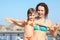 Woman with her daughter on deck of cruise ship