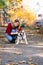 Woman with her dog in autumn park