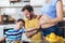 Woman and her family breakfasting in the kitchen