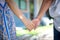 Woman and her friend hand together finger