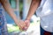 Woman and her friend hand together finger