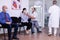 Woman and her husband crying in new normal hospital waiting room