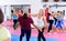 Woman with her instructor are training self-defence moves in gym.