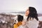 Woman and her Tibetan terrier dog on a snowy day