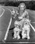Woman with her two dogs on a race track