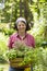 Woman with herbs in a garden