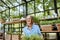 Woman with herbs in the greenhouse