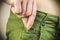 Woman hides wedding ring in jeans pocket