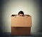 Woman hiding in a carton box