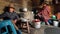 Woman from the high Andes cooking in small kitchen.