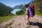 Woman hike with backpack at the lake of highlands of Altai mount