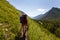 Woman hike with backpack at the lake of highlands of Altai mount