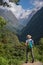 Woman hiker with backpack standing on the rock enjoy mountain view Annapurna ,Nepal.