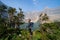 Woman hiker with backpacking gear at Iceberg Lake in Glacier National Park