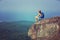 Woman hiker enjoy the view hiking on mountain peak