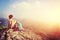 Woman hiker enjoy the view at mountain peak cliff