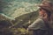 Woman hiker enjoying amazing valley landscapes on a top of mountain.