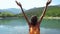 Woman hiker enjoying a landscape with mountain lake.