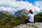 Woman hiker enjoys the view of Key Summit with Ailsa Mountain at