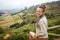 Woman hiker in front of beautiful landscape view