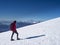 Woman hiker on a glacier with crampons on boots