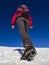 Woman hiker on a glacier with crampons on boots