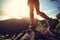 Woman hiker hiking stand on cliff