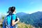 Woman hiker at mountain peak