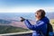 Woman Hiker Pointing at the Gorgeous Scenery