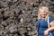 Woman hiker poses on the Trail to Lava Butte on the trail of Molten Lands in Newberry National Volcanic Monument in Oregon