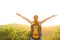 Woman hiker raised arms mountain top