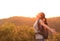 Woman hiker raised arms mountain top