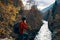 woman hiker river landscape travel laptop adventure