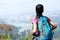 Woman hiker stand mountain peak