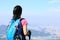 Woman hiker stand mountain peak