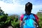 Woman hiker stand mountain peak