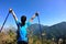 Woman hiker stand mountain peak