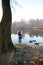 Woman hiker stand and relax on the riverbank