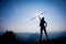 woman hiker stand on sunrise mountain peak rock edge