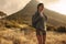 Woman hiker standing on a countryside trail