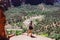 Woman hiker standing with a great view in Zion national park, Utah