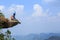 woman hiker thinking on mountain peak cliff