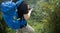 Woman hiker using smartphone